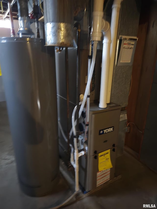 utility room with gas water heater