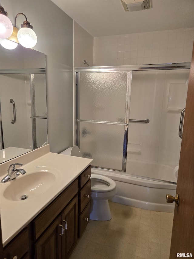 full bathroom featuring toilet, enclosed tub / shower combo, visible vents, tile patterned floors, and vanity