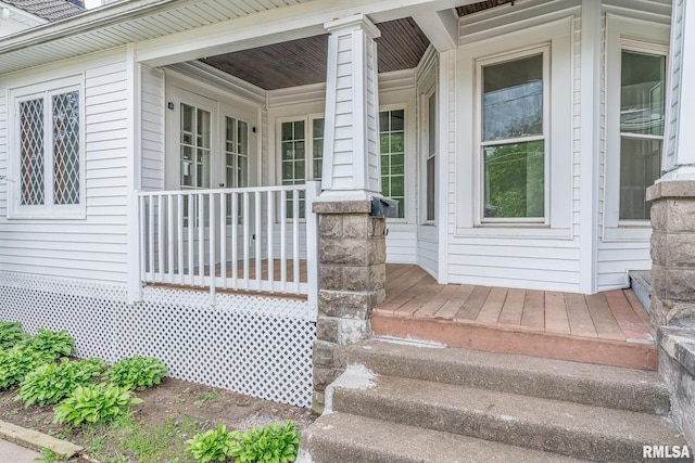 doorway to property featuring a porch