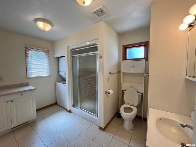 bathroom with a stall shower, visible vents, baseboards, and vanity
