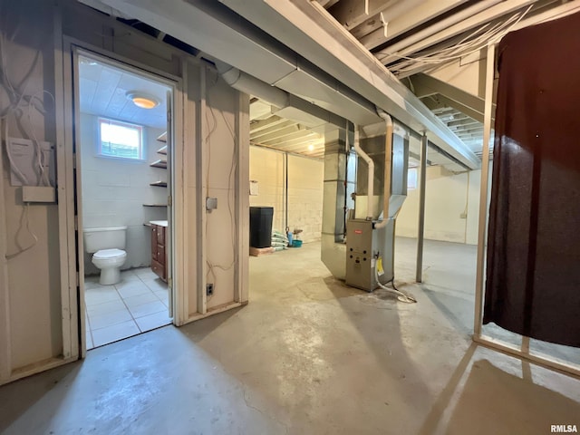 below grade area featuring heating unit