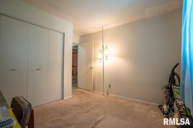 unfurnished bedroom featuring a closet and light carpet