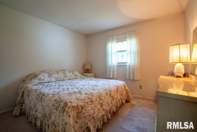 carpeted bedroom featuring baseboards