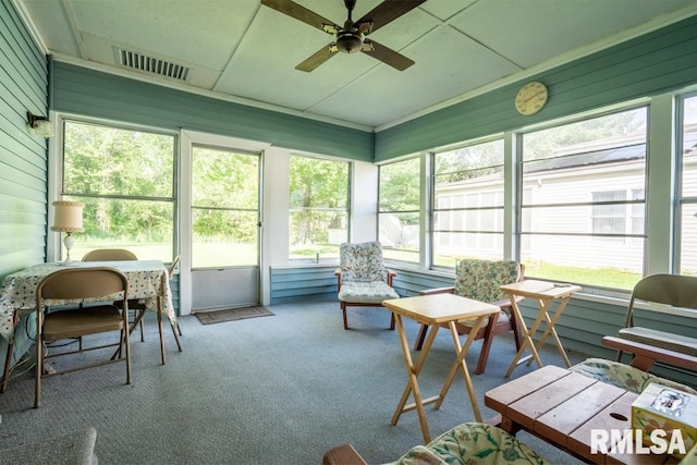 sunroom with visible vents and a ceiling fan