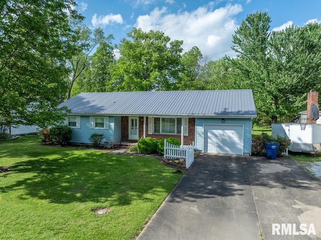 single story home with metal roof, aphalt driveway, an attached garage, and a front yard