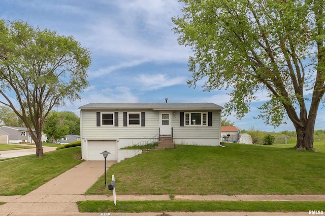 view of front facade with concrete driveway, a front yard, an attached garage, and entry steps