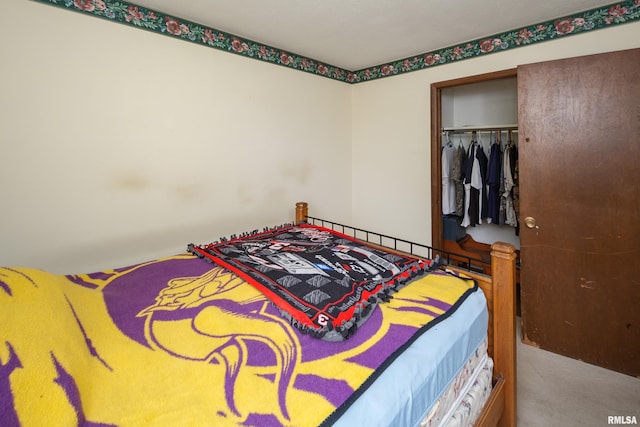 bedroom featuring a closet and carpet floors