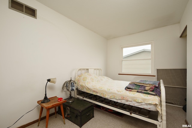 bedroom featuring visible vents, baseboards, and carpet floors