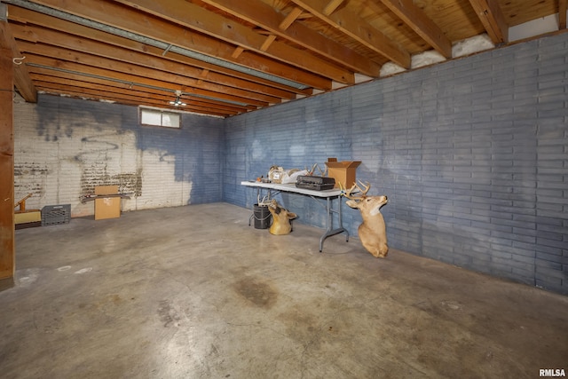 below grade area with brick wall