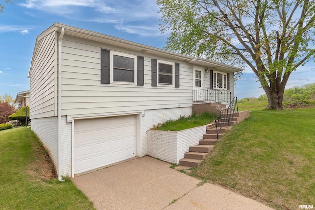 view of front of house featuring concrete driveway, an attached garage, and a front lawn