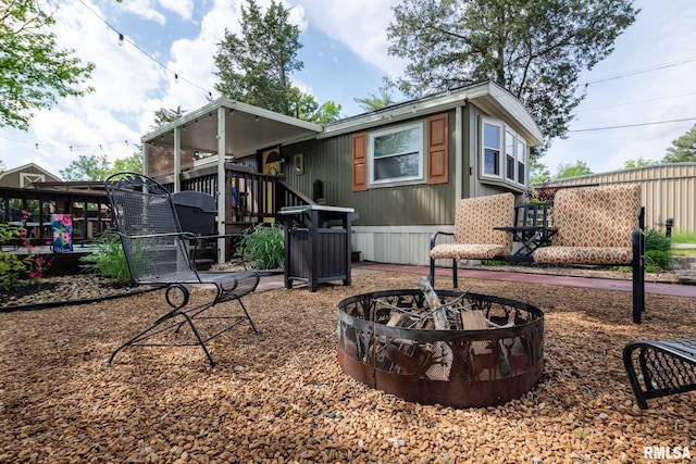 208 E Alexander St, Energy, IL 62933 - back of house featuring a fire pit