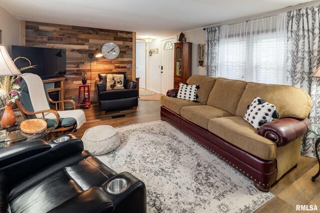 208 E Alexander St, Energy, IL 62933 - living area with wood walls and wood finished floors