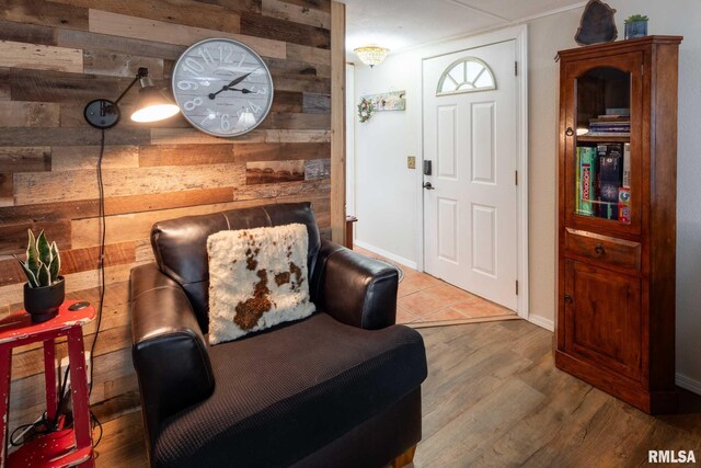 208 E Alexander St, Energy, IL 62933 - sitting room featuring wooden walls, wood finished floors, and baseboards