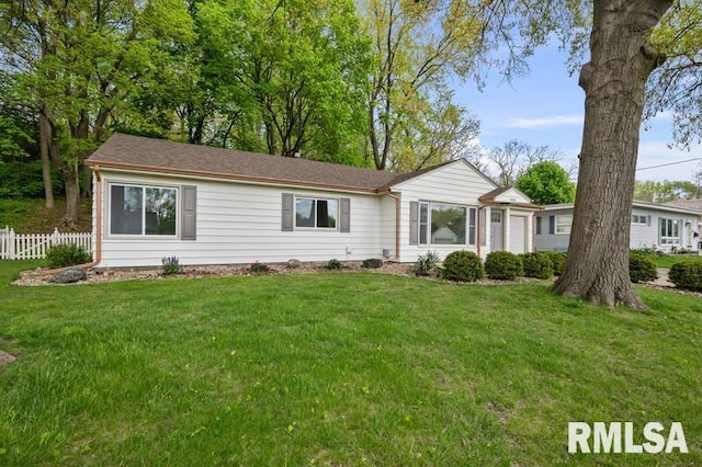 single story home featuring a front lawn and fence