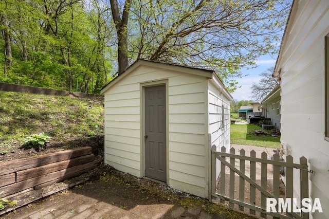 view of shed with fence