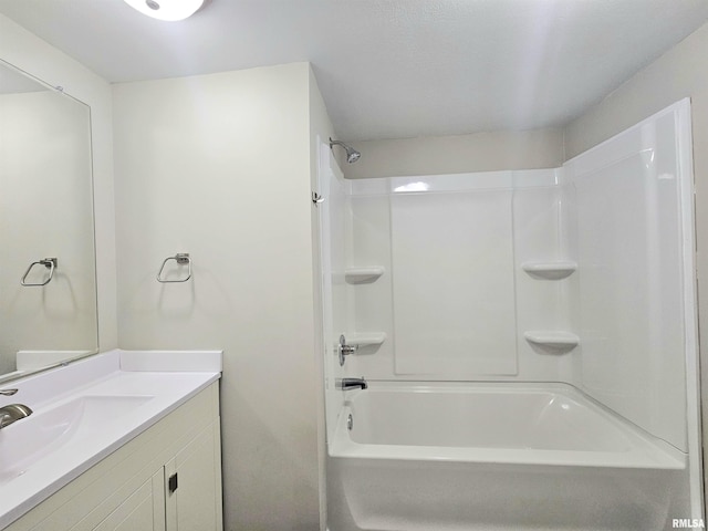 bathroom with vanity and washtub / shower combination