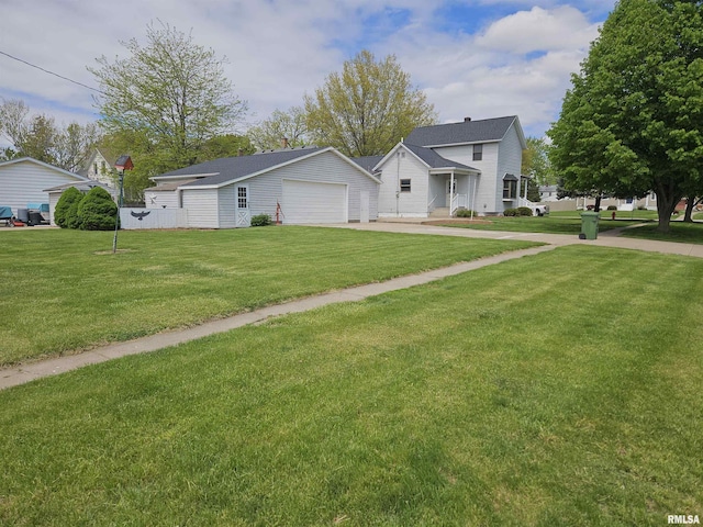view of front facade featuring a front lawn, a garage, and concrete driveway