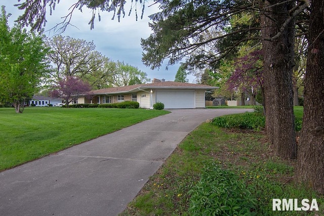 ranch-style house featuring concrete driveway, a front yard, and a garage