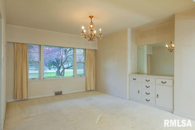 interior space featuring an inviting chandelier, light carpet, baseboards, and visible vents