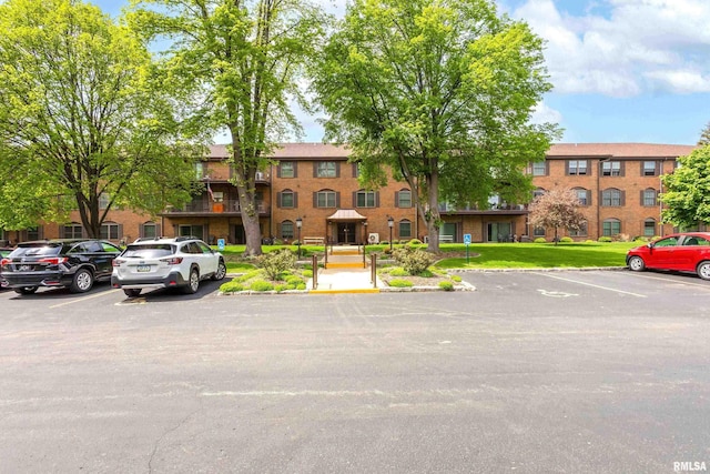 1360 Kimberly Ridge Rd Unit 309, Bettendorf, IA 52722 - view of property with uncovered parking