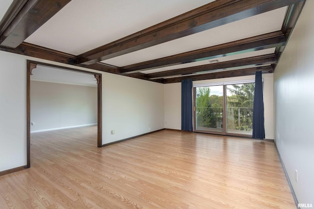 1360 Kimberly Ridge Rd Unit 309, Bettendorf, IA 52722 - empty room with light wood-style floors, baseboards, and beamed ceiling