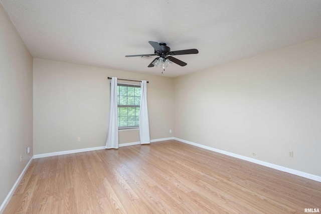 1360 Kimberly Ridge Rd Unit 309, Bettendorf, IA 52722 - empty room with baseboards, light wood-style floors, and ceiling fan