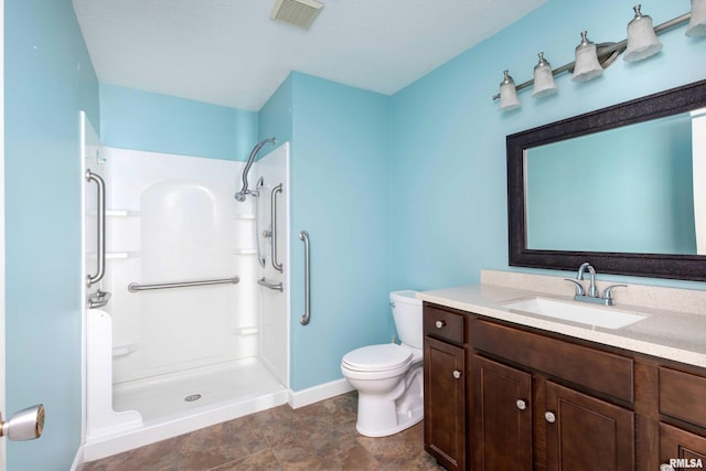 1360 Kimberly Ridge Rd Unit 309, Bettendorf, IA 52722 - bathroom featuring toilet, visible vents, baseboards, walk in shower, and vanity