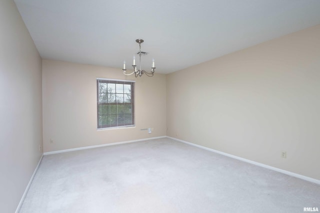 1360 Kimberly Ridge Rd Unit 309, Bettendorf, IA 52722 - carpeted spare room with a chandelier, baseboards, and visible vents