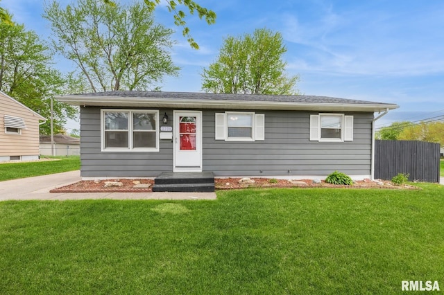 ranch-style home with fence and a front yard