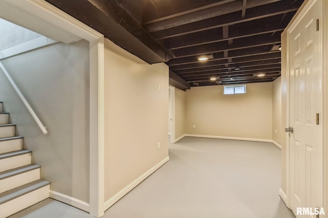 below grade area with baseboards and stairs