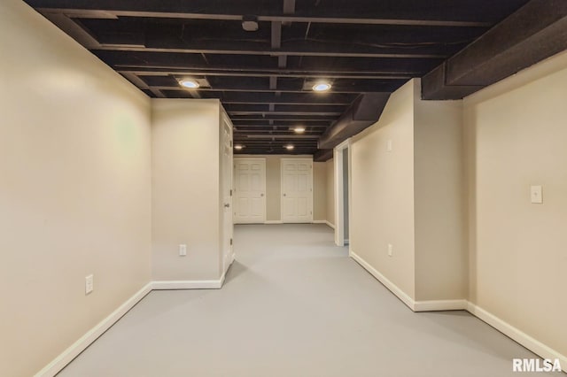finished basement featuring baseboards