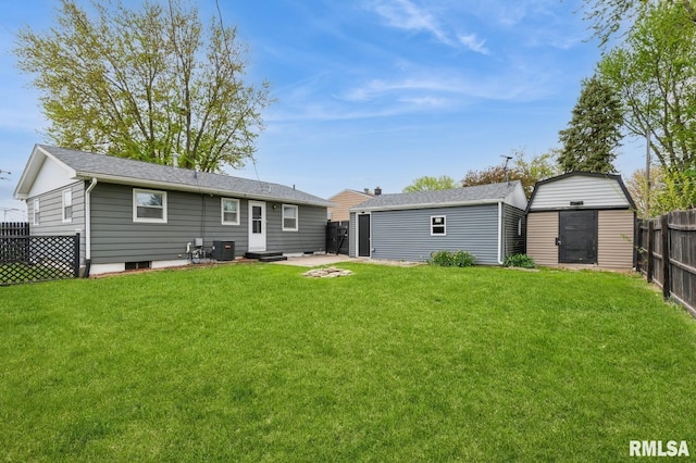rear view of property featuring a fenced backyard, entry steps, central AC, and a lawn