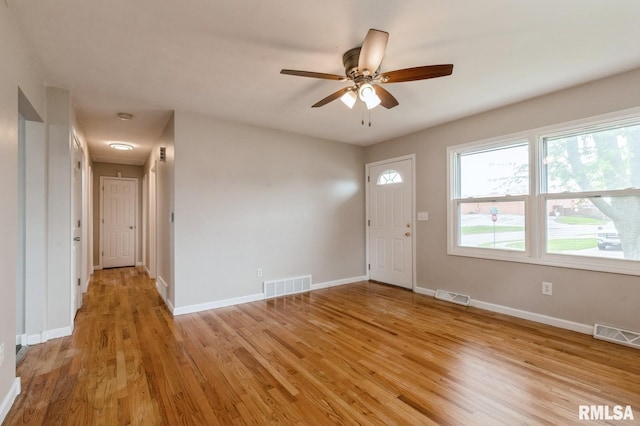 entrance foyer featuring ceiling fan, light wood finished floors, and visible vents
