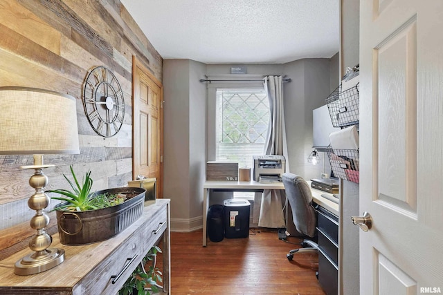 home office with baseboards, dark wood-style flooring, and a textured ceiling