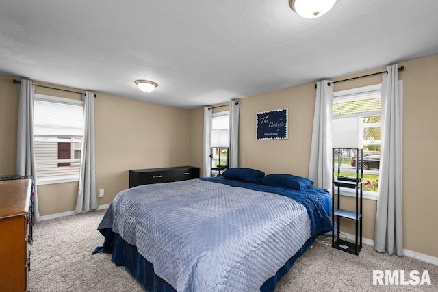 carpeted bedroom with baseboards