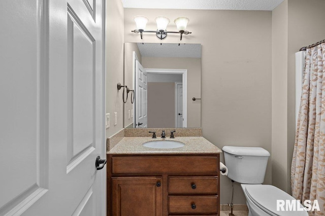 full bath featuring toilet and vanity