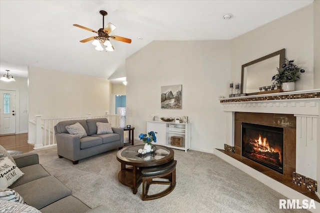 17 Blackstone Way, Le Claire, IA 52753 - carpeted living area with ceiling fan, a glass covered fireplace, and high vaulted ceiling