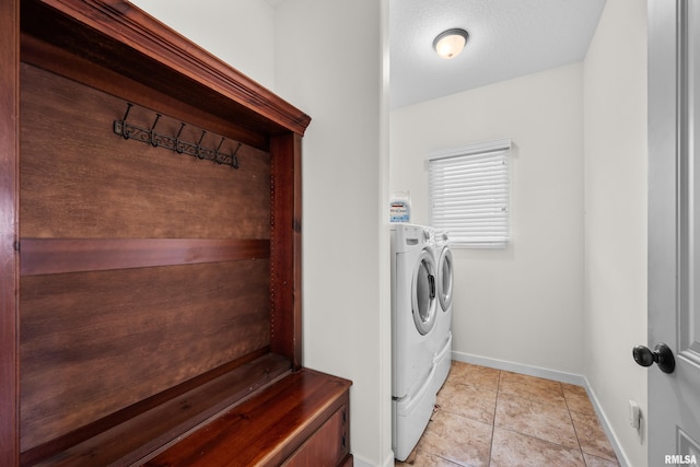 17 Blackstone Way, Le Claire, IA 52753 - laundry room featuring independent washer and dryer, baseboards, and light tile patterned flooring