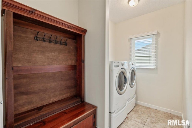17 Blackstone Way, Le Claire, IA 52753 - washroom featuring washing machine and clothes dryer, baseboards, and light tile patterned floors