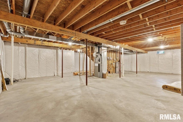17 Blackstone Way, Le Claire, IA 52753 - unfinished basement featuring gas water heater and heating unit