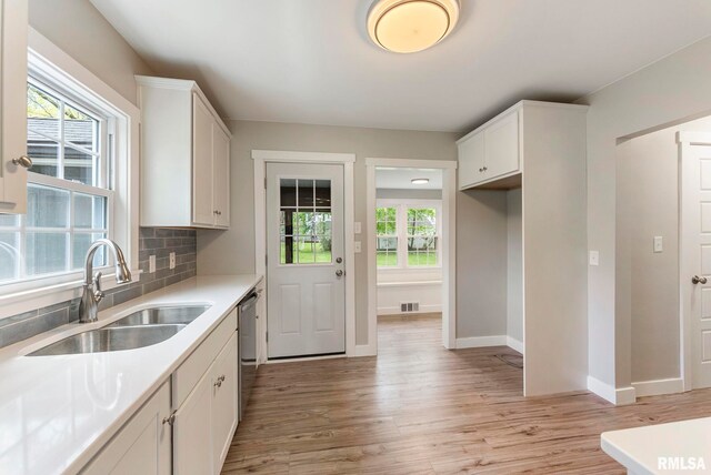 rear view of property with a sunroom and a lawn