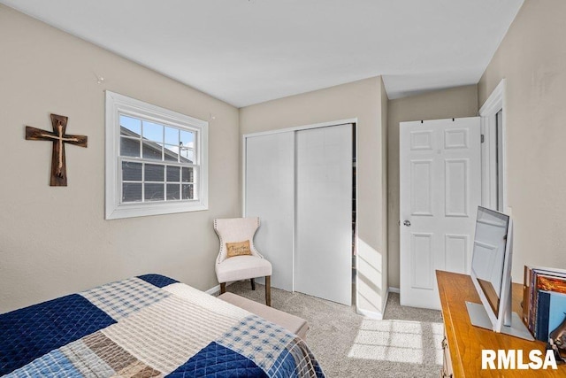 carpeted bedroom with a closet