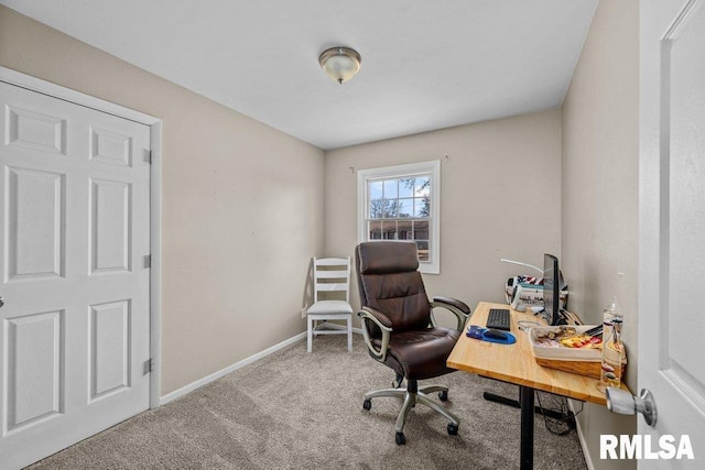 carpeted office space with baseboards