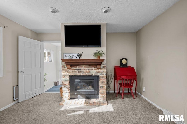 carpeted living room with baseboards, a brick fireplace, and a textured ceiling