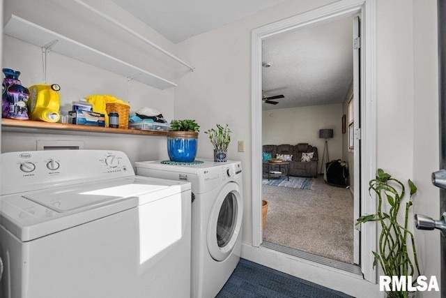 clothes washing area with laundry area, washer and clothes dryer, a ceiling fan, and carpet floors