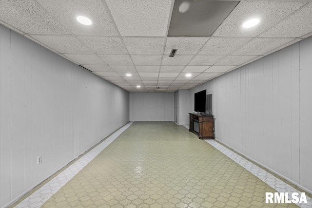 finished below grade area featuring tile patterned floors and recessed lighting