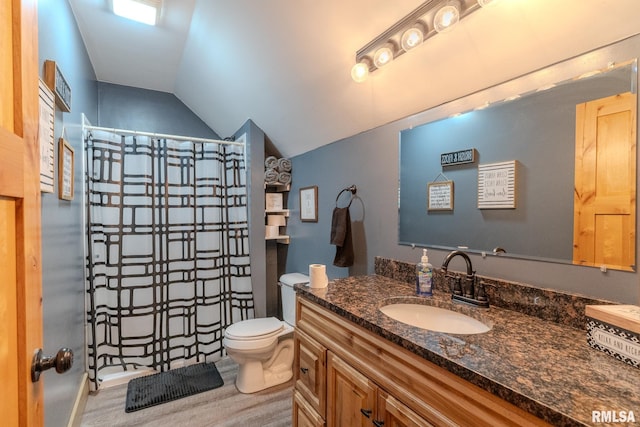 full bathroom with vaulted ceiling, toilet, a shower with shower curtain, vanity, and wood finished floors