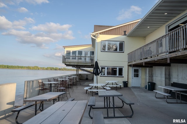 view of patio with a water view