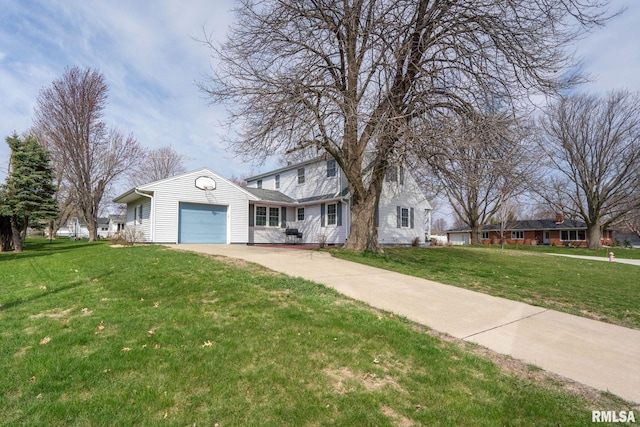 view of front of house with a garage, driveway, and a front lawn