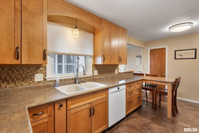 kitchen featuring dishwasher, a sink, decorative backsplash, baseboards, and brown cabinets